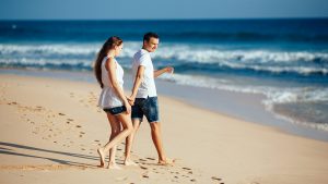 couple walking on a beach